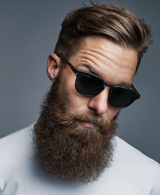Collage of men’s beard styles with grooming tools