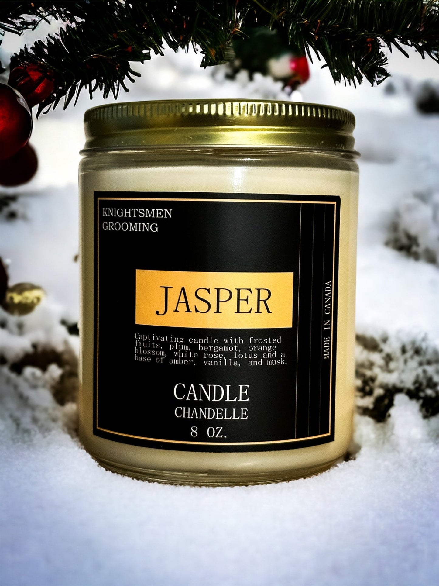 Candle jar labeled 'Jasper' by Knightsmen Grooming in the snow.