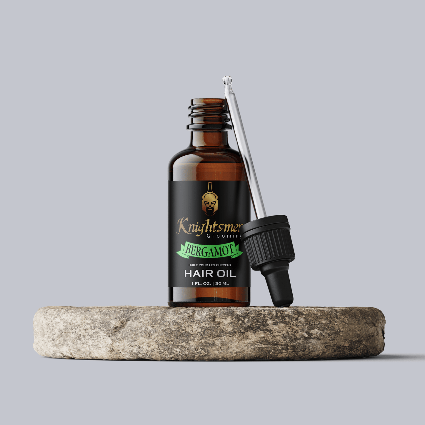 Premium bergamot Organic hair oil with glass dropper on stone—hydrating, hair growth formula and strengthening formula.