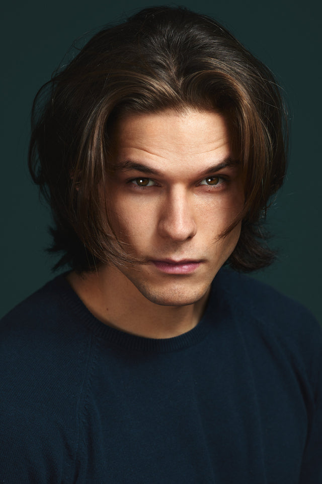 Man with textured medium length wolf cut hairstyle