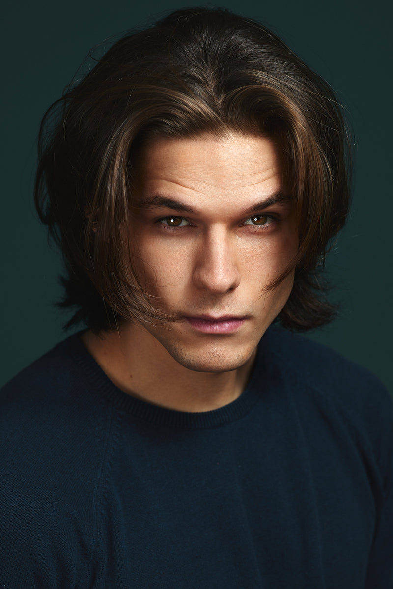 Man with textured medium length wolf cut hairstyle