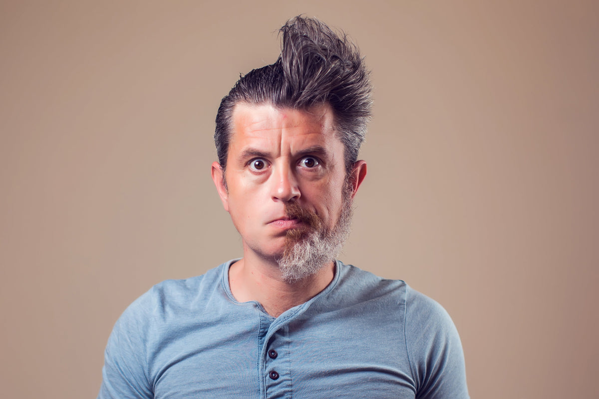Portrait of man with a stylish beard fade hairstyle