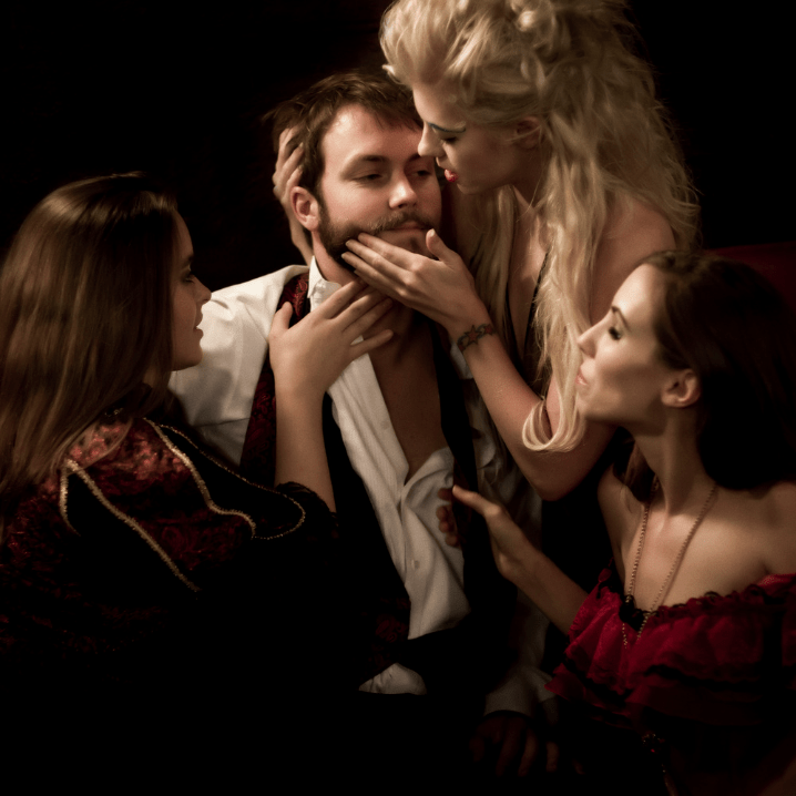 Confident bearded man with well‑groomed beard—attractiveness theme. Women all over man. Harem.