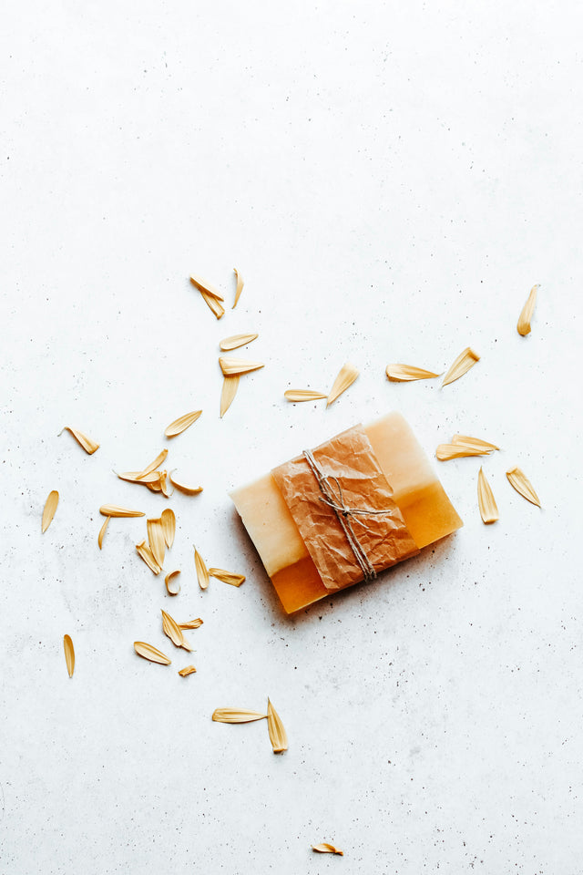 Handmade natural soap bar with oat flakes, evoking the oatmeal, shea butter, and honey in Knightsmen Grooming's soap bar