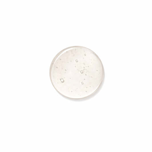 Organic body wash gel being poured showing rich natural texture and consistency
