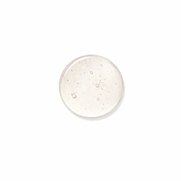 Organic body wash gel being poured showing rich natural texture and consistency
