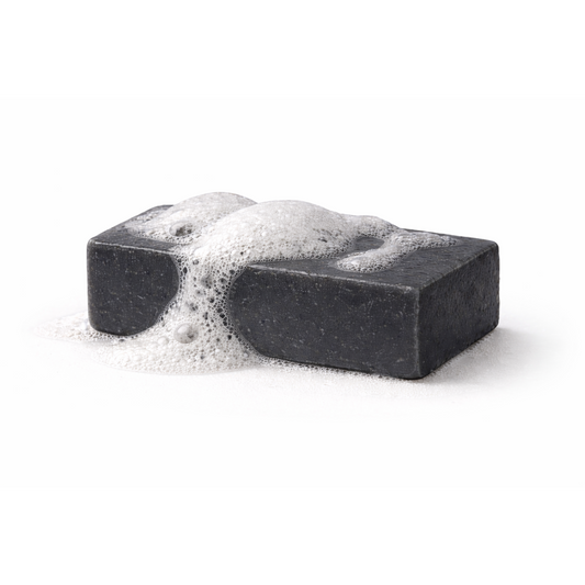 Dark charcoal facial cleanser gel texture showing activated coconut charcoal
