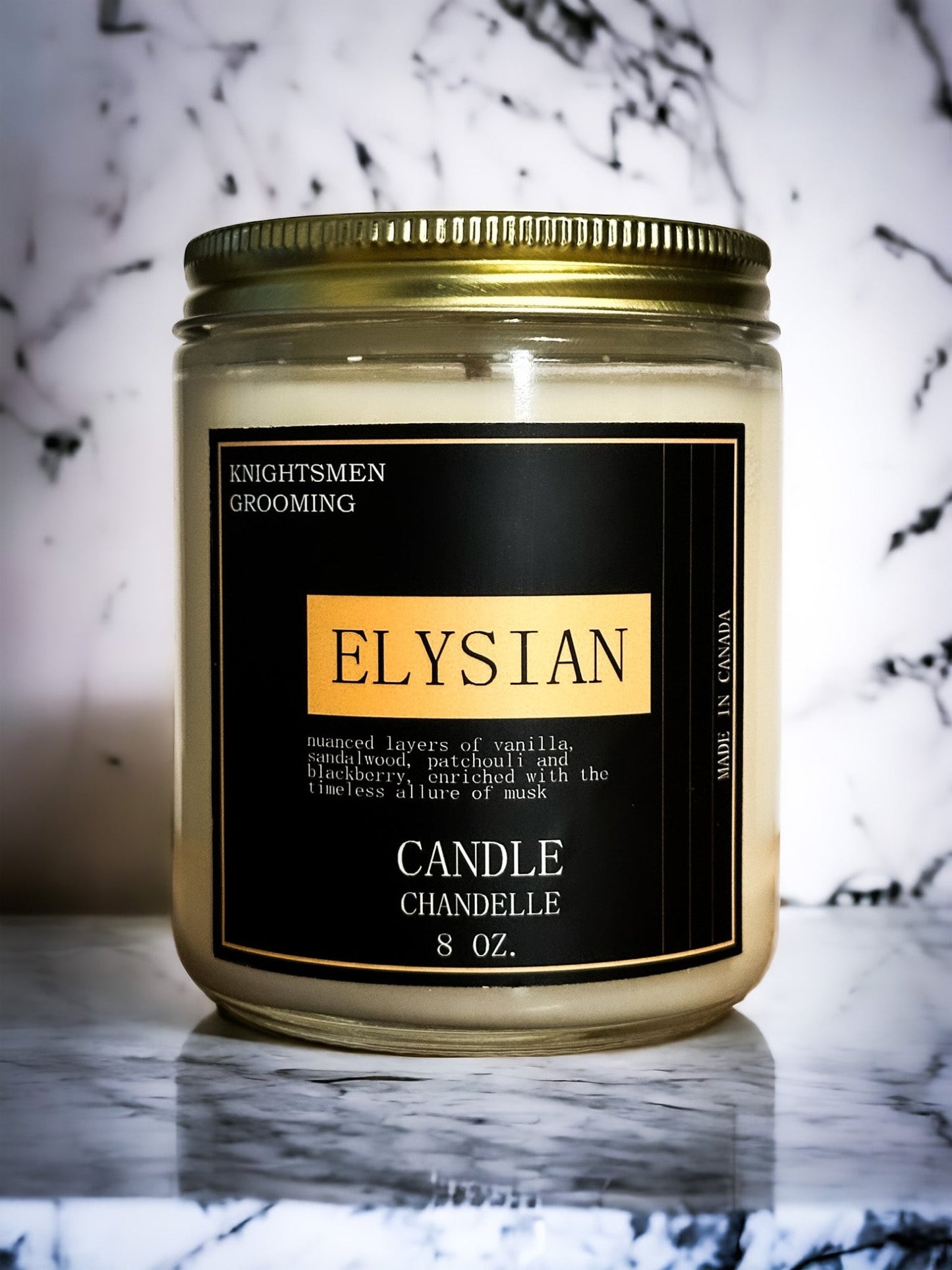Candle jar labeled 'Elysian' on a marble surface