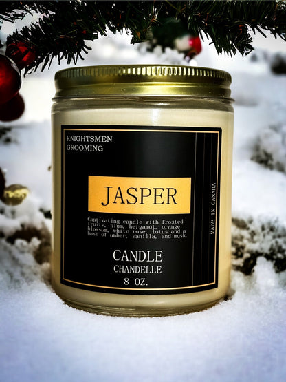 Candle jar labeled 'Jasper' by Knightsmen Grooming in the snow.