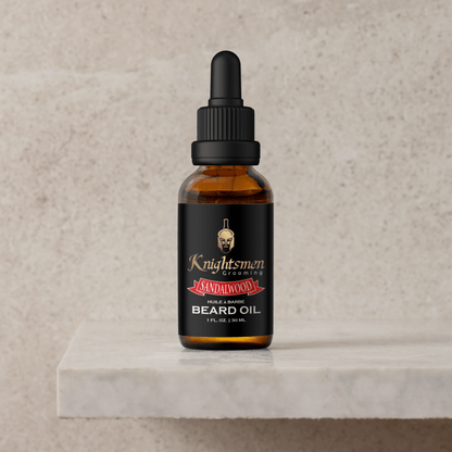 Sandalwood organic beard oil bottle on stone pedestal. Sandalwood beard oil for growth, beard oil for patchy beards
