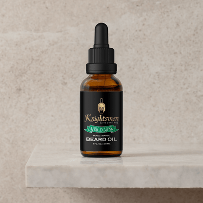 African Musk organic beard oil bottle on stone pedestal. Luxury beard oil
