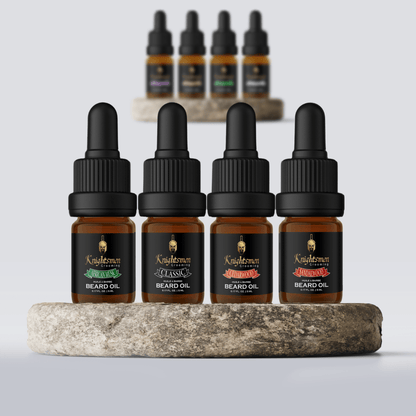Beard oil bundle 5 ml bottles with caps on shelf—African Musk, Classic, Cedarwood, Sandalwood travel pack.