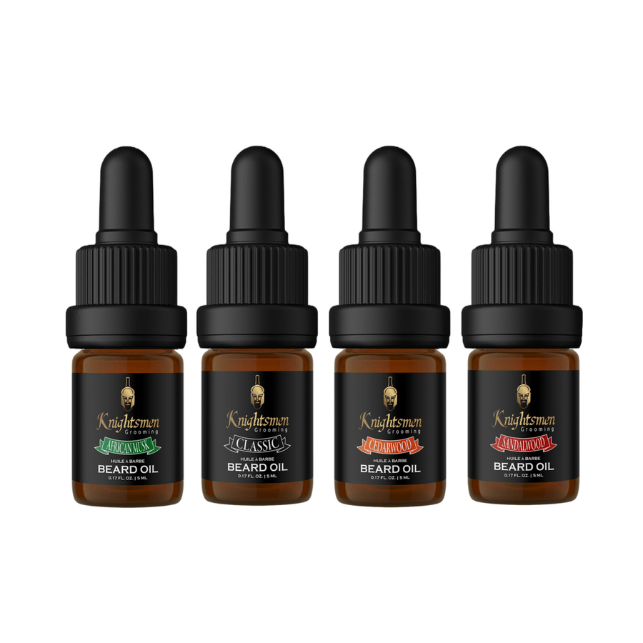 Four 5 ml beard oils with caps on stone pedestal—travel size gift set, African Musk, Classic, Cedarwood, Sandalwood.
