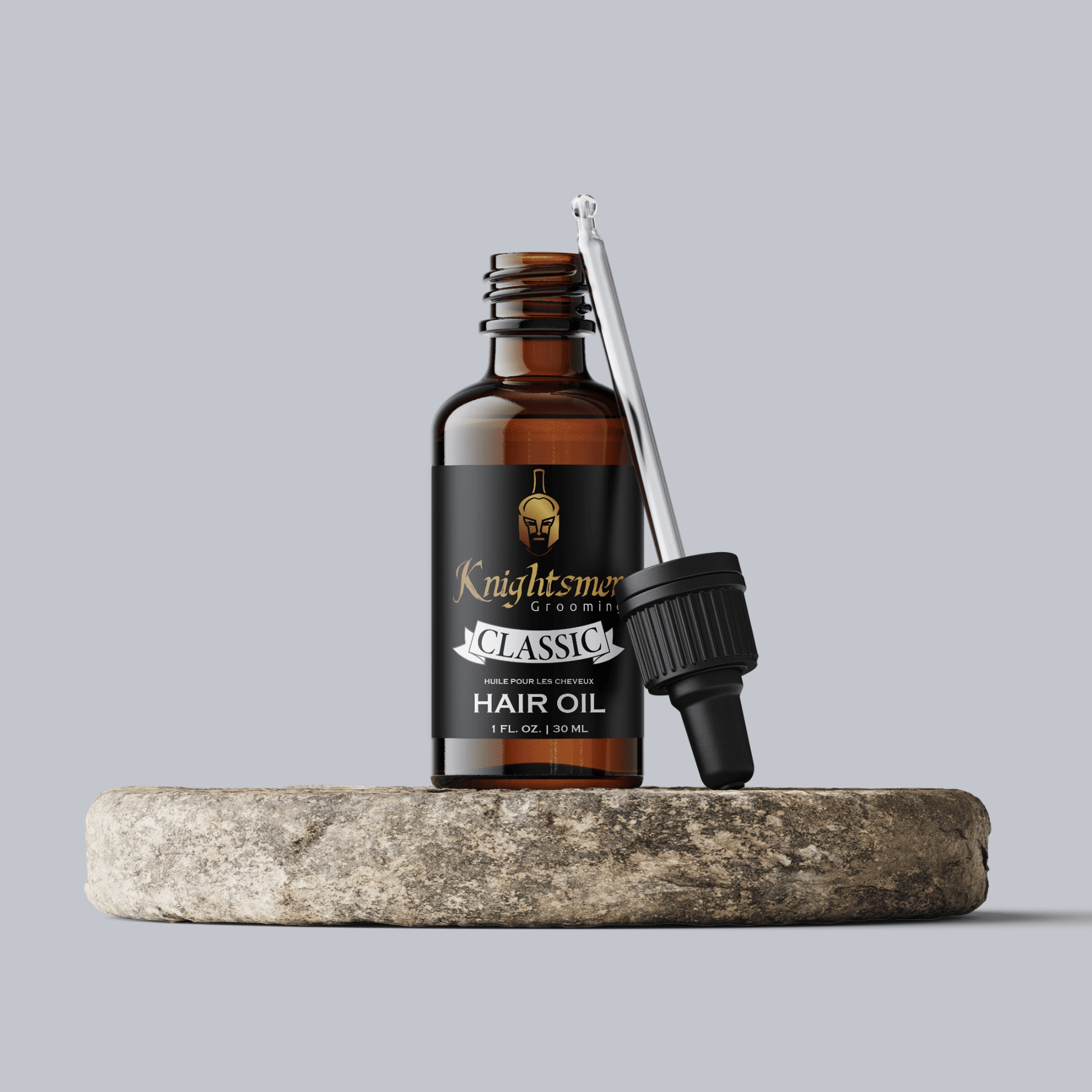 Premium Organic hair oil with glass dropper on stone—hydrating, hair growth formula and strengthening formula.