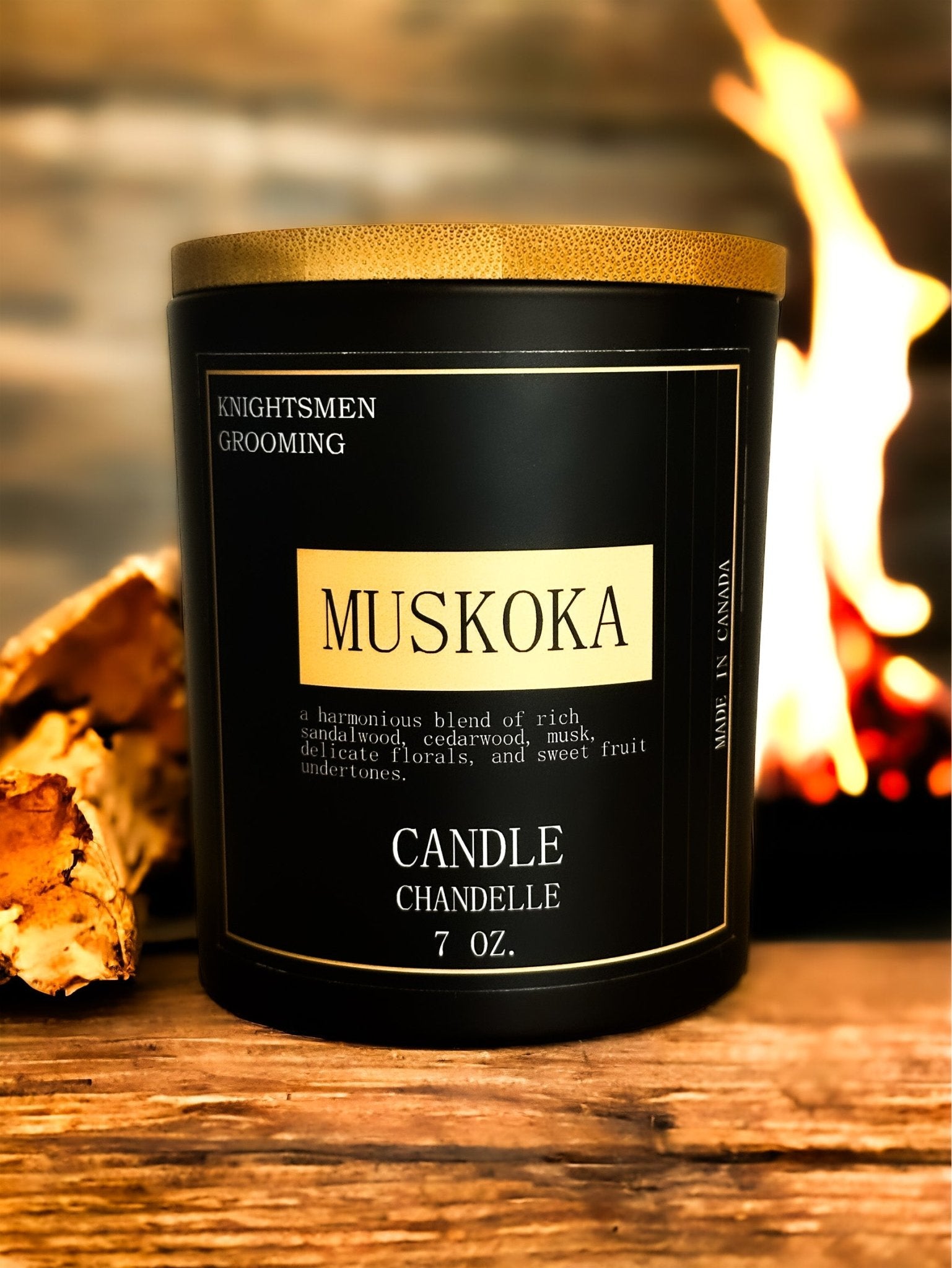 Muskoka soy candle burning with warm amber glow in a cozy living space
